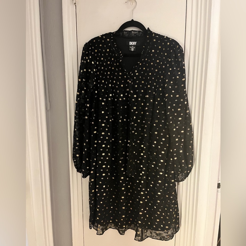Gold pooka dot DKNY flowing dress in pristine condition great for any occasion.